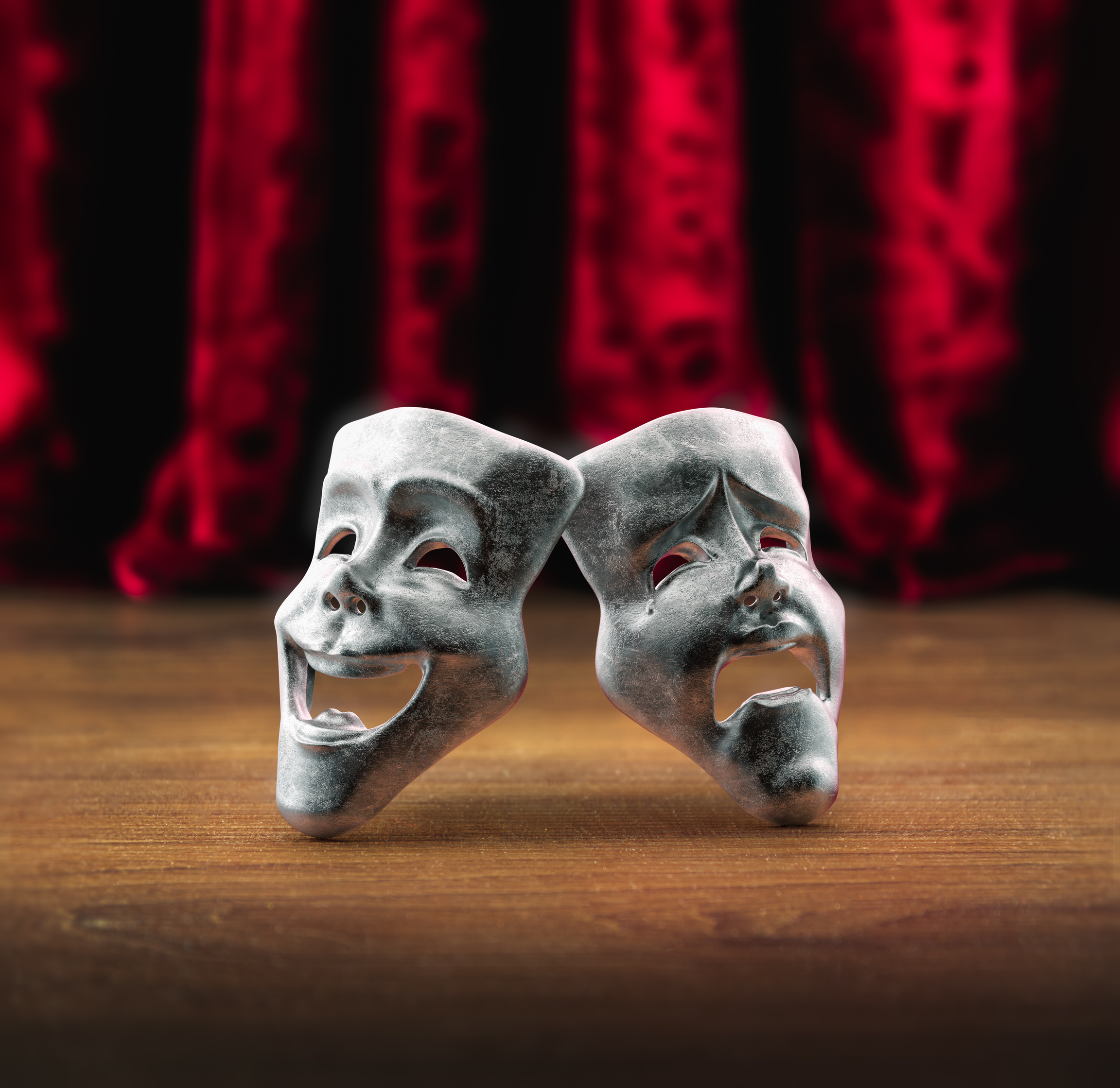 Theater masks in front of a red curtain/ 3D rendering